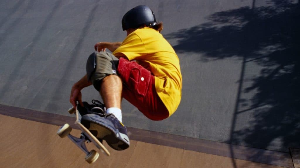 look cool while wearing skateboarding helmet and skateboard protective gear