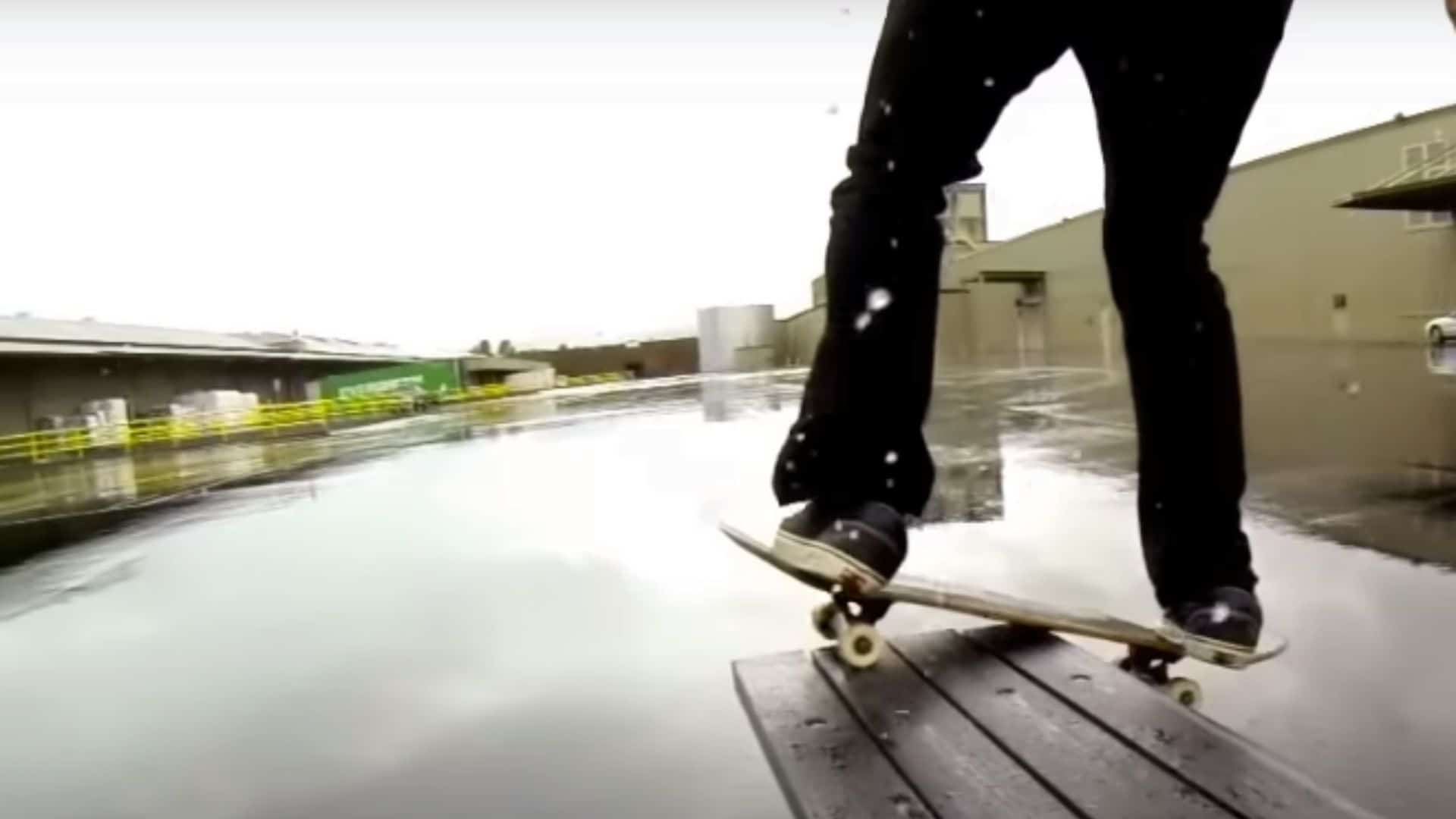 skater skateboarding in rain 