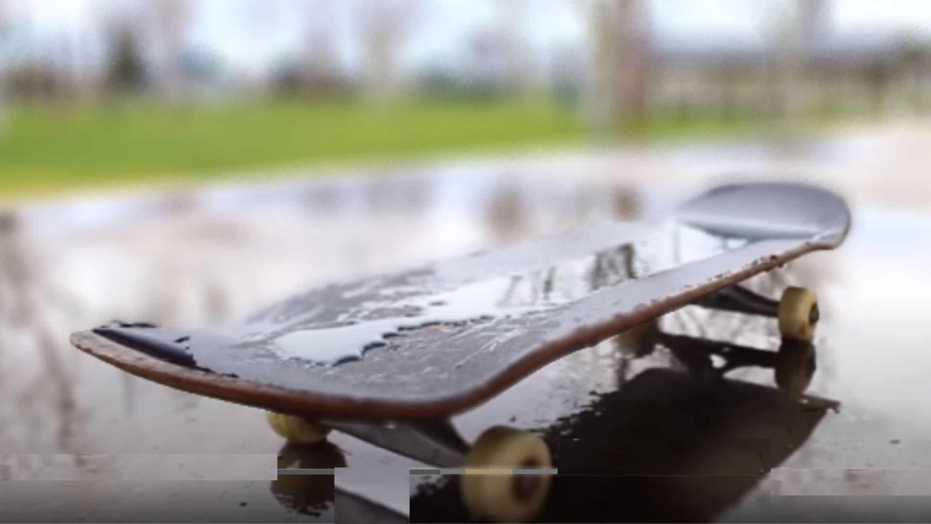 skateboard on the watery ground in rain
