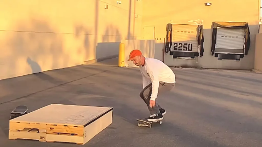 skateboarding on a grind box