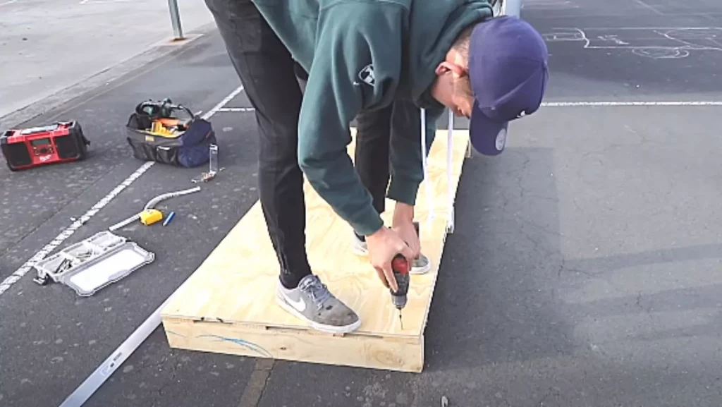 adding plywood at the of skateboarding grind box 